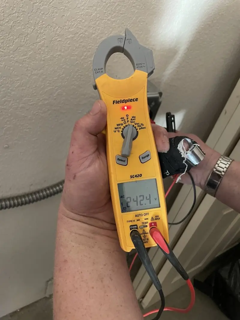 Voltage testing with clamp meter during Hot Tub / Pool Electrical Wiring in Brutus